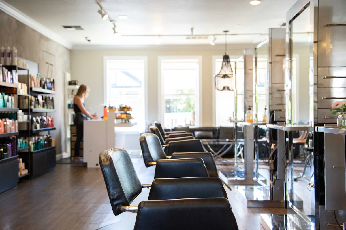 A stylist in a calm, upmarket hair salon
